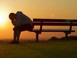 Depressed person on a bench