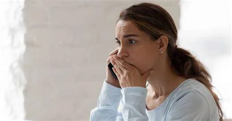 Distressed woman on phone
